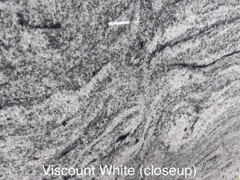 Closeup image of Viscount White granite, showing a textured surface with wavy, swirling gray and black patterns on a light background. The text Viscount White (closeup) appears at the bottom.